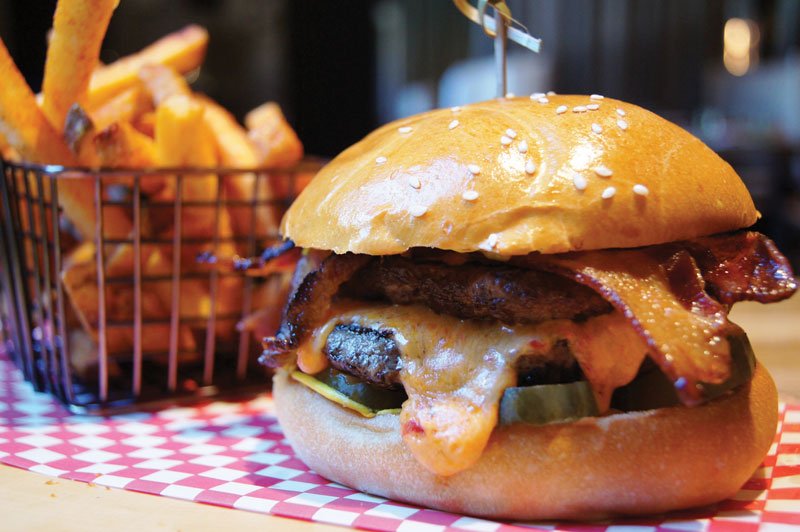 Two short-rib patties distinguish the H&H Pimento Cheese Burger at Orlando, Fla.’s Highball & Harvest, with pimento cheese adding Southern personality.