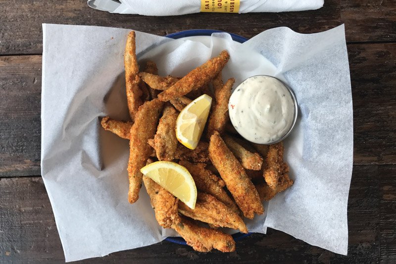 At Saint Lou’s Assembly, slightly sweet smelts are dipped in cornmeal batter, then fried. A dash of togarashi seasoning sets them apart, as does a flavor-packed chimichurri aïoli.