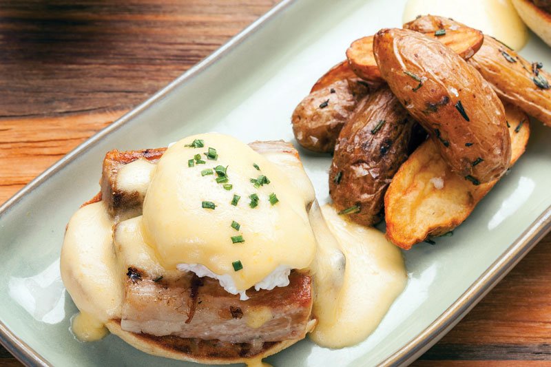 The Hog and The Egg combines pork belly with poached eggs and hollandaise at Burlock Coast Seafare & Spirits in Fort Lauderdale, Fla.