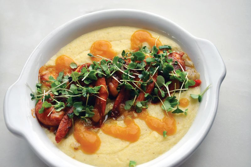 Grits get dressed up in the Shrimp & Grits offered at Parks & Rec Diner in Detroit, with housemade popcorn grits, harissa and hot sauce.