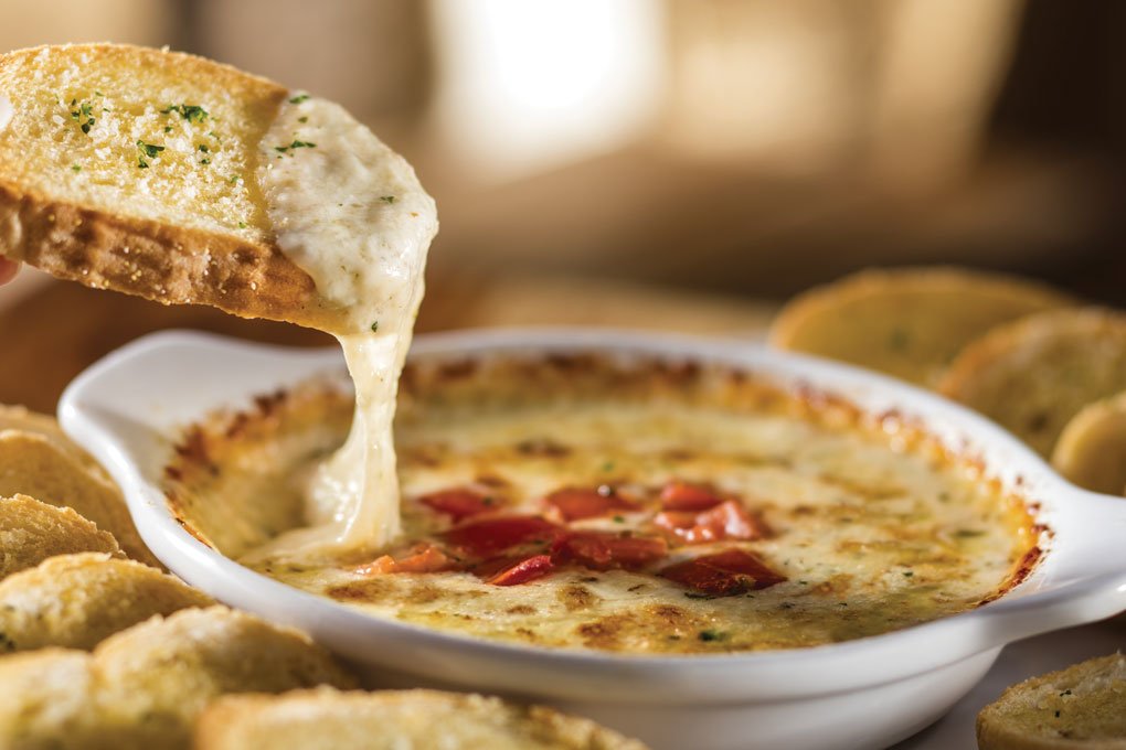 Olive Garden’s oh-so shareable Five Italian Cheese Fonduta melds oven-baked smoked provolone, Parmesan, fontina, mozzarella and Romano.