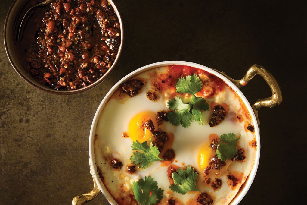 A comforting dish of baked eggs gets a jolt of texture with a peanut-chile salsa macha, created by Shelly Bojorquez, culinary director of Hofman Hospitality Group in Southern California.