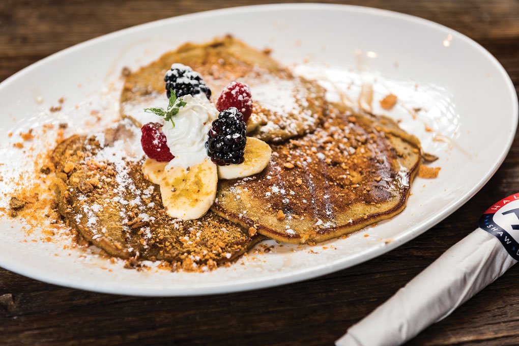 At HalfSmoke in Washington, D.C. The Bart vs. The Kwik-E-Mart banana pancakes get a finishing sprinkle of crunchy Butterfinger candy