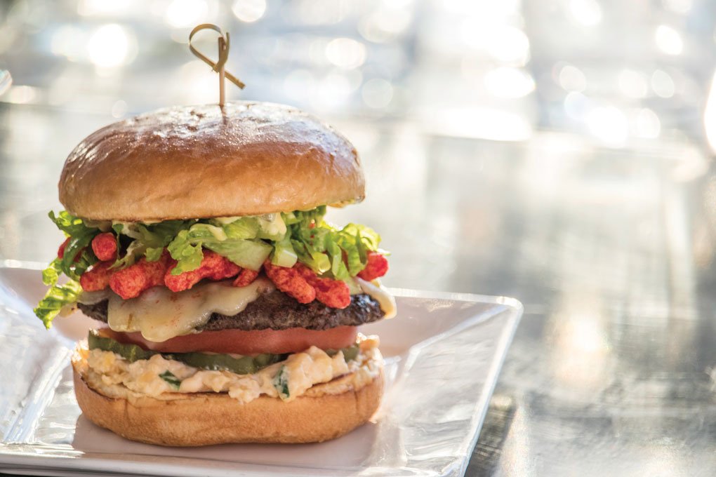 Hot Cheetos help make the name of the Over the Top Cheeseburger at Rel’Lish Burger Lounge at Seattle-Tacoma International Airport.