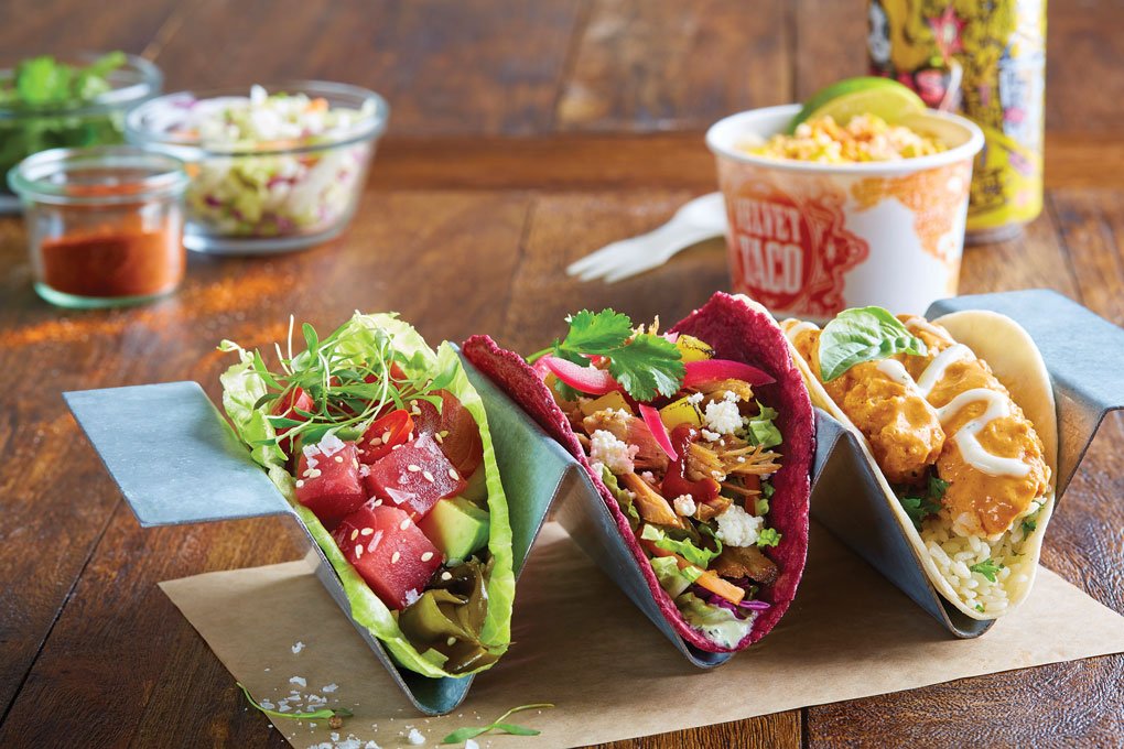 Velvet Taco offers choices galore, reflecting different global influences. Here, the Ahi Poke, Annatto Shredded Pork, and Picnic Chicken all nod to varied cuisines, in keeping with the concept’s mission to prove that tacos need not be confined to Tex-Mex flavors.