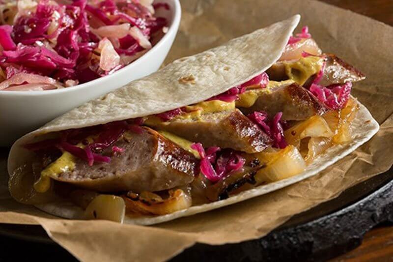 Beer Braised German Bratwurst With Onions in a Tortilla