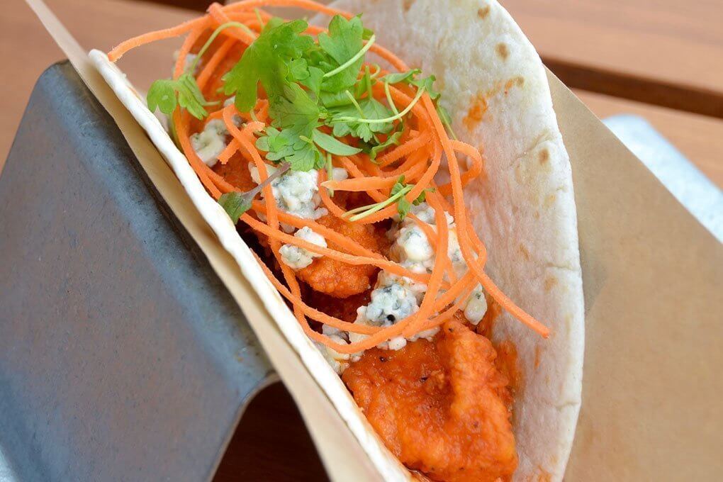 Tucking popular, proven flavor systems into a tortilla is a good tactic for familiar-yet-exotic menu adaptations. Velvet Taco’s Buffalo Chicken Taco is a clever example