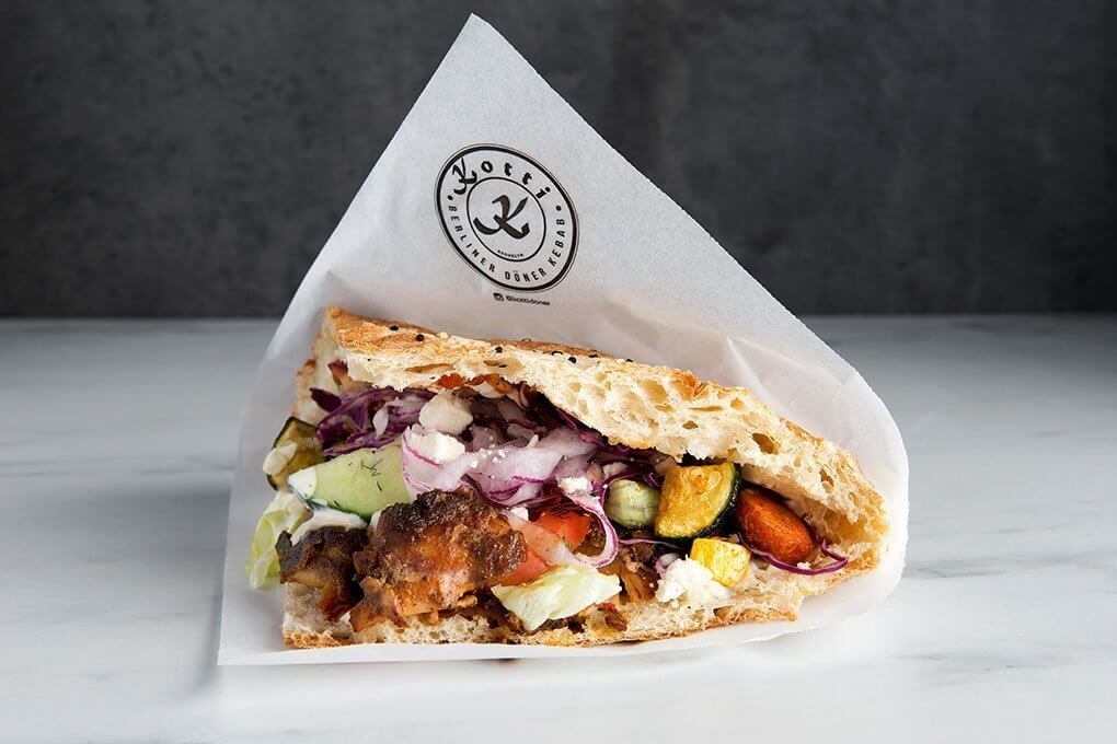 In New York, Kotti Berliner’s döner kebab exemplifies the rich layering of flavors this sandwich offers. Here, marinated chicken is layered with veggies including cucumber with dill and pickled red cabbage, feta, a squeeze of lemon and and dill yogurt sauce