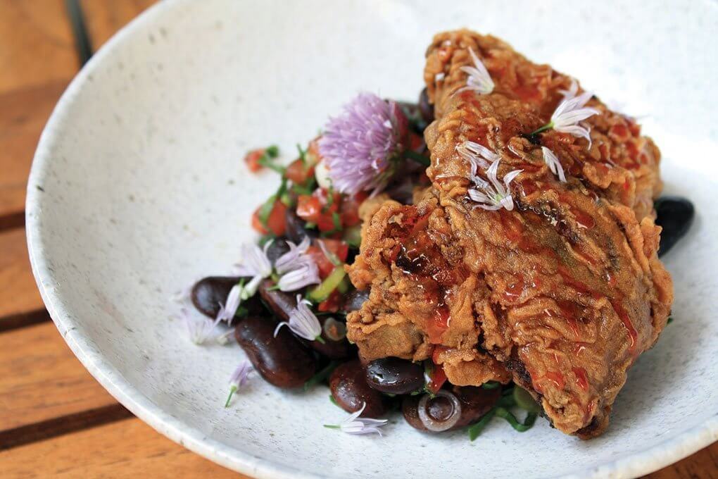 Fried chicken with Tennessee caviar, spiced honey, and sable hot sauce, from Sable Restaurant, Palomar Hotel, Chicago