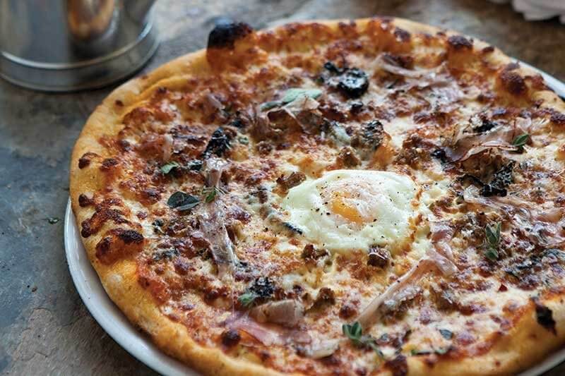 At Prato in Winter Park, Fla., Executive Chef Brandon McGlamery likes how the nuttiness of the toasted hazelnut plays off the licorice of the fennel in this Widowmaker Pizza, with hazelnut romesco, fennel sausage, cavolo nero and an egg.