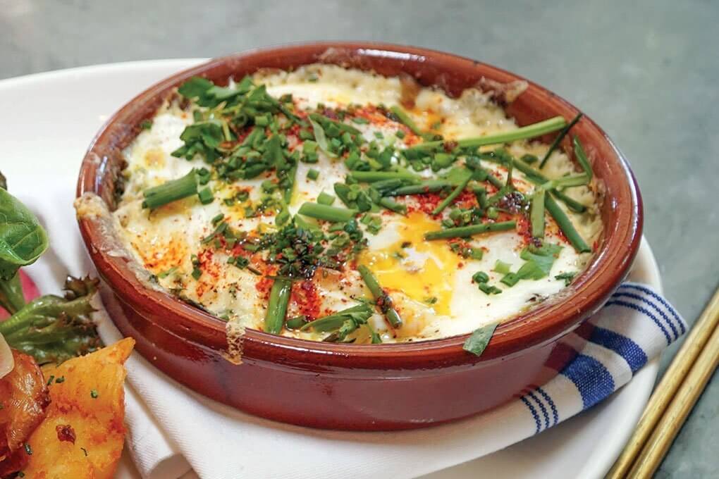 Sauvage's version of Baked Eggs has fines herbes, hen-of-the-woods mushrooms and raclette.