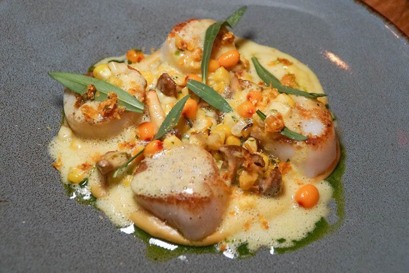 Sea buckthorn berries provide an acidic accent to the scallops with corn and chanterelles at Camperdown Elm in Brooklyn, N.Y.