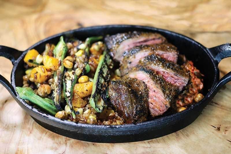 Twin Peaks’ Jamie Carawan is developing an Adobo Crusted Steak, a modern entrée with no trade down: six ounces of grass-fed beef, smoked ancient grains, sauté of corn and okra, roasted vegetable purée and fried chickpeas.