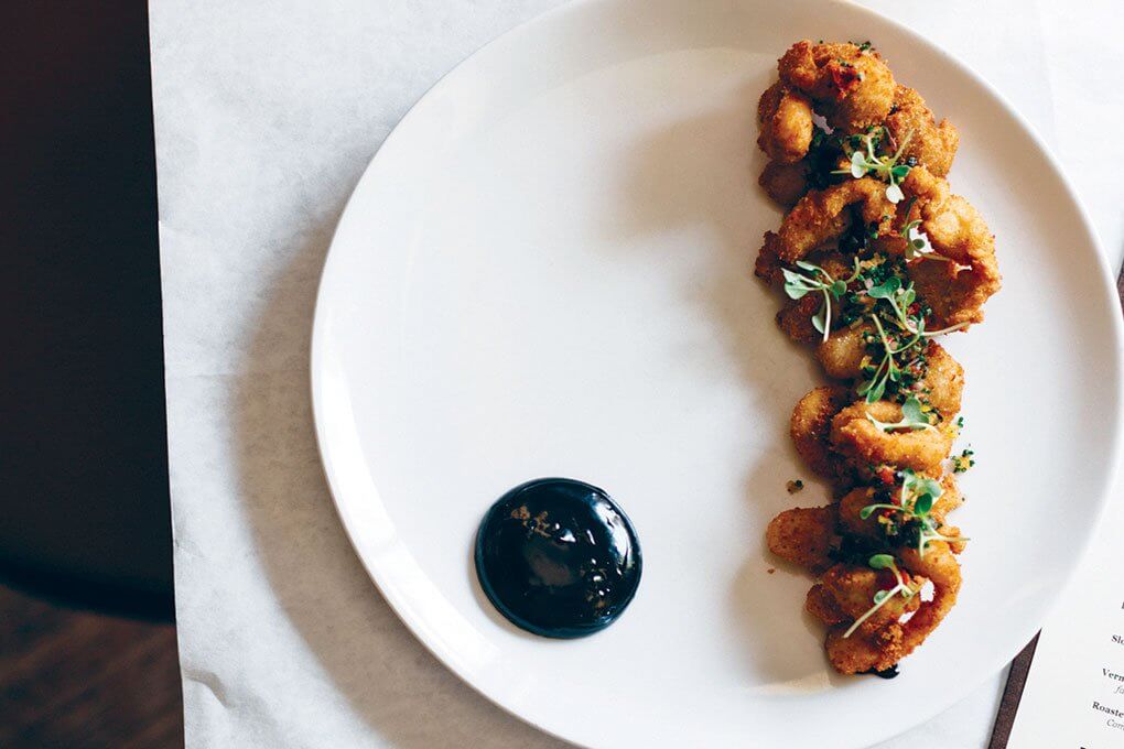 Crispy-Fried Essex Clams with preserved lemon, pickled peppers, dried black olive, squid ink anchoïade