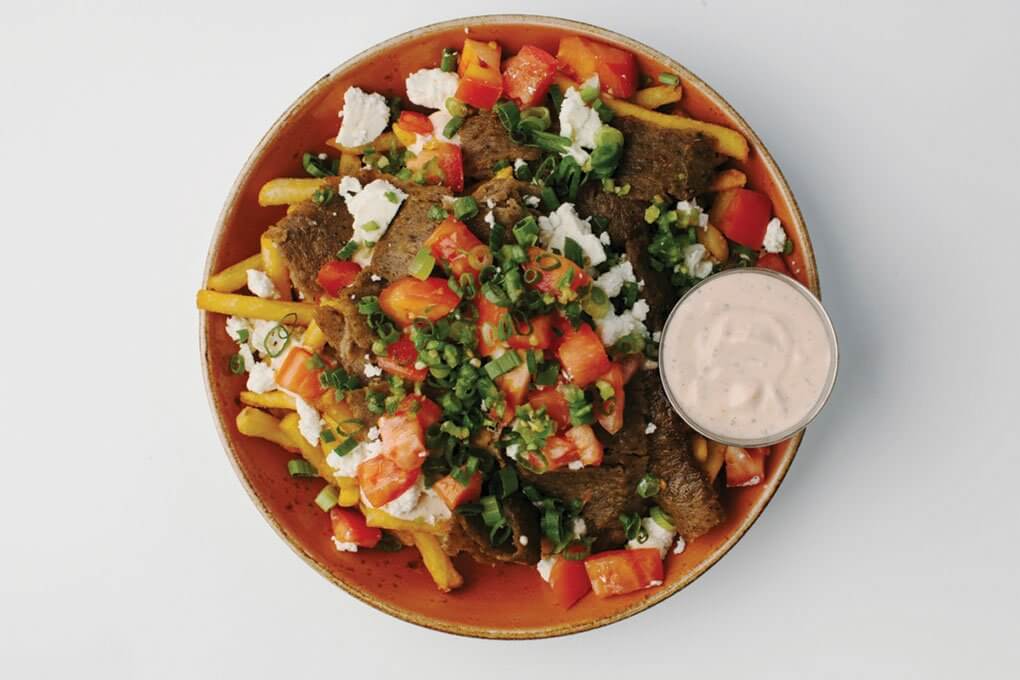 Beef and lamb gyros, french fries, feta, tomato, Serrano pepper, green onion, spicy cucumber yogurt sauce