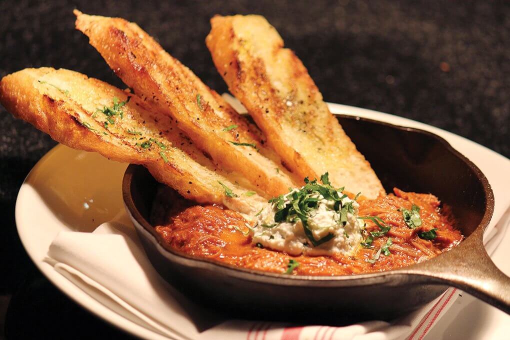 Lamb Neck Gravy with whipped ricotta and garlic crostini