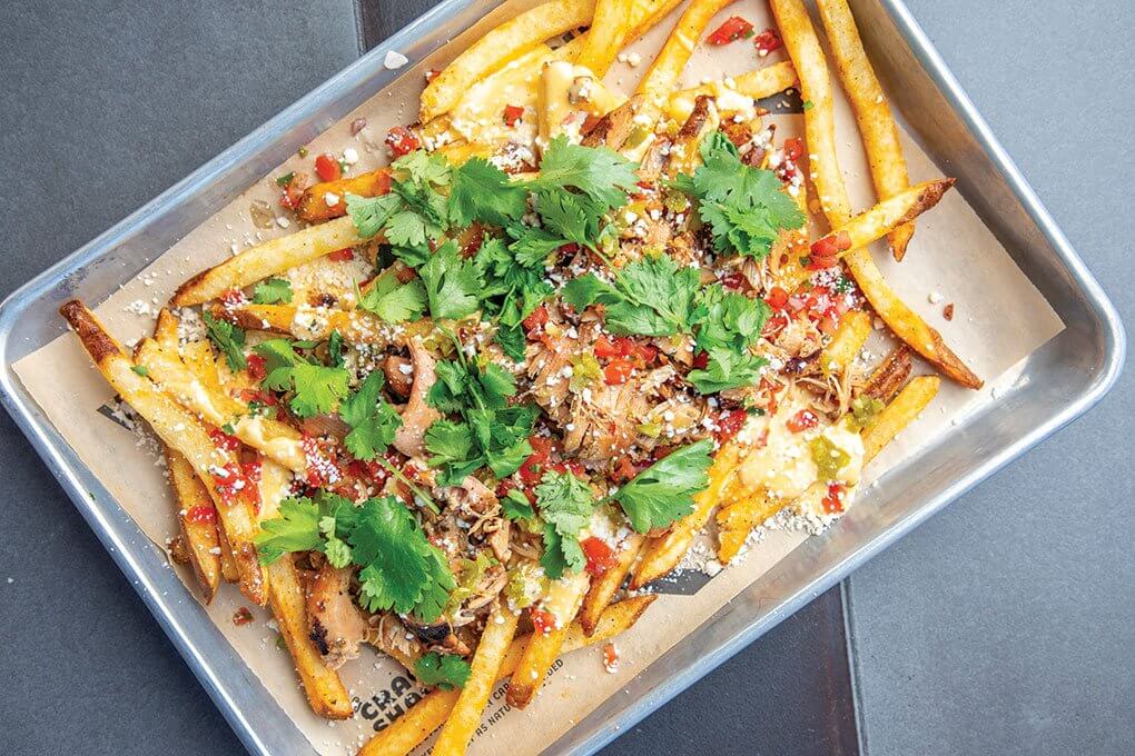 Schmaltz fries, pollo asado, jalapeño “Cheez Whiz”