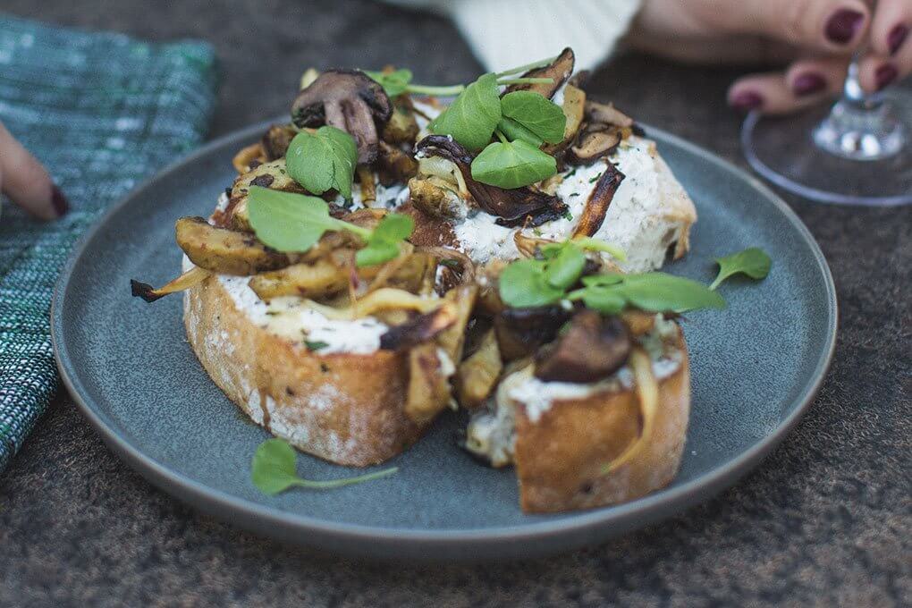 Roasted Artichoke and Mushroom Toast with black truffle goat cheese, caramelized onion, sherry gastrique