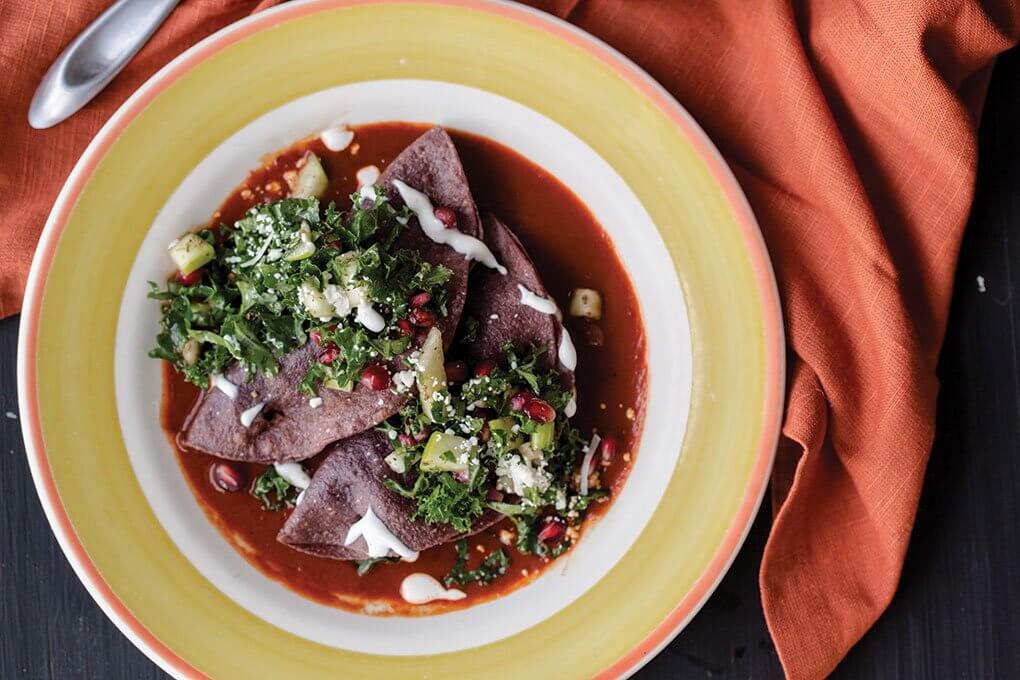 Butternut squash, black-bean/corn salsa, blue-corn tortillas, red chile sauce, pomegranate-kale slaw, maple cream, pumpkin seeds, Cotija