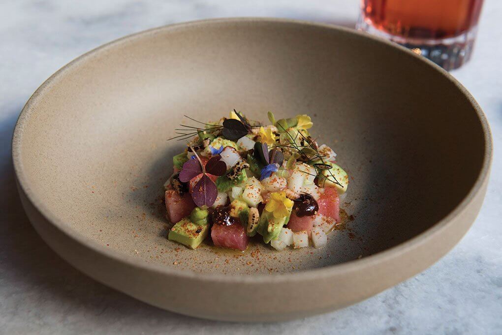 Puffed black rice, raw tuna, avocado, green apple, sev, potato, green mango, tamarind chutney, green chile, radish, cilantro cress