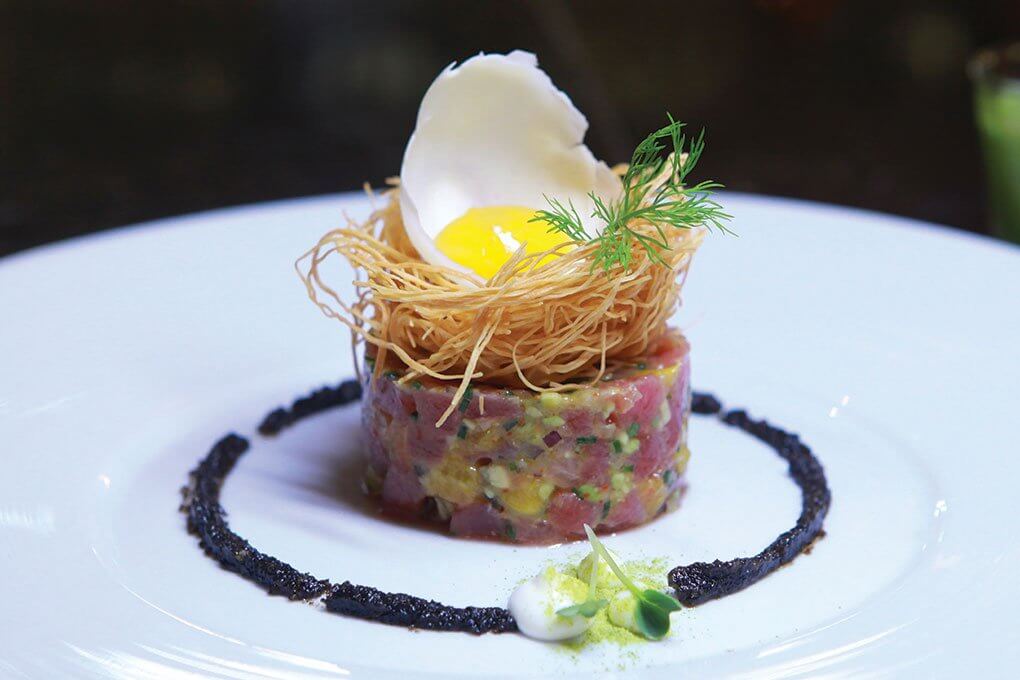 Tuna Tartare with avocado salsa, mushrooms, fresh citrus, phyllo, cheese crisp, yuzu, olive-almond pesto