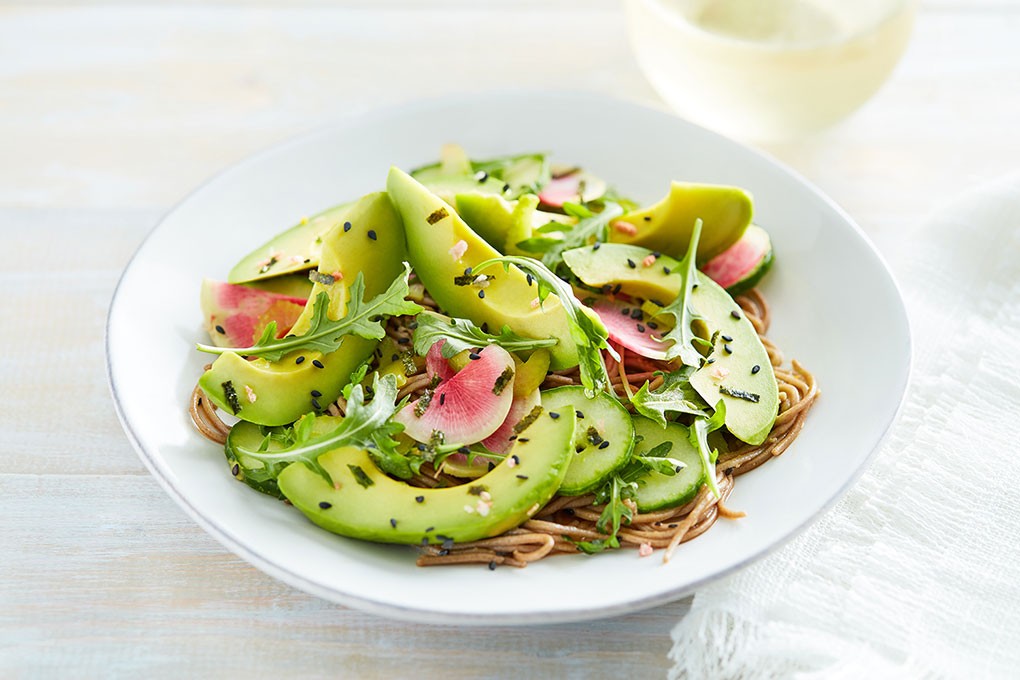 With striking visual appeal, cold soba noodles are dressed with a miso-ginger vinaigrette and topped with arugula, pickled vegetables, watermelon radish, California avocado and furikake seasoning.