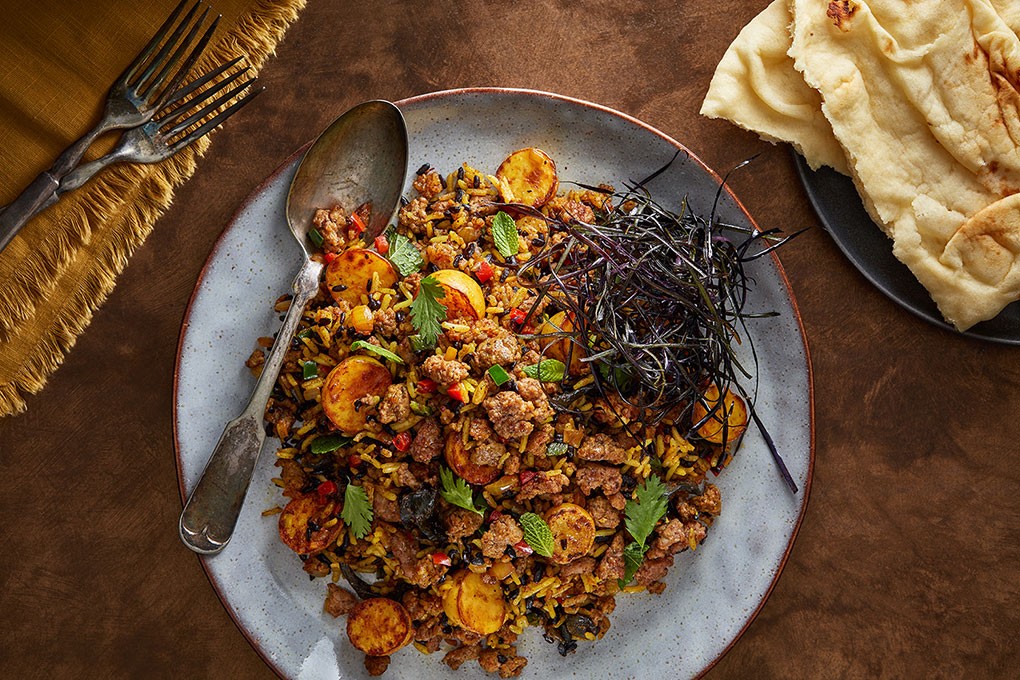 Featuring ground lamb, harissa, tikka masala and Kashmiri chile powder, this recipe offers a global take on a Cajun classic.