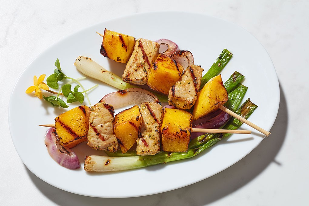 Chef Olivier Gaupin’s pairing of grilled pork and mango showcases how well the flavor of fire comes out in fruit when grilled.
