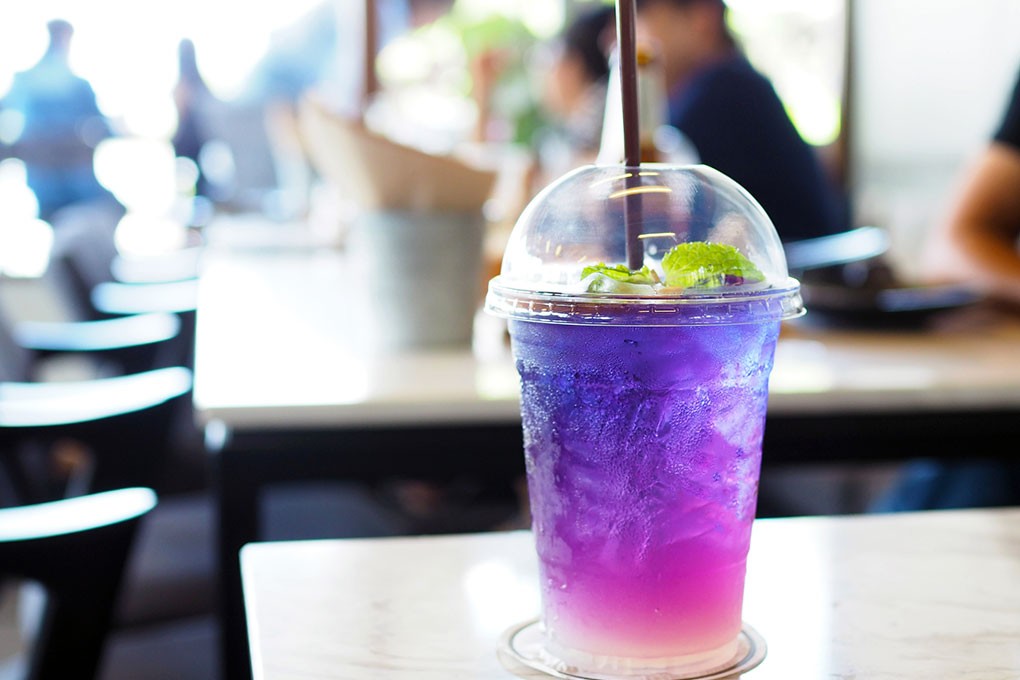 Butterfly pea syrup electrifies non-alc offerings, like this grapefruit-mint soda, with its magical ability to transform from blue to purple with a simple swizzle of a straw.