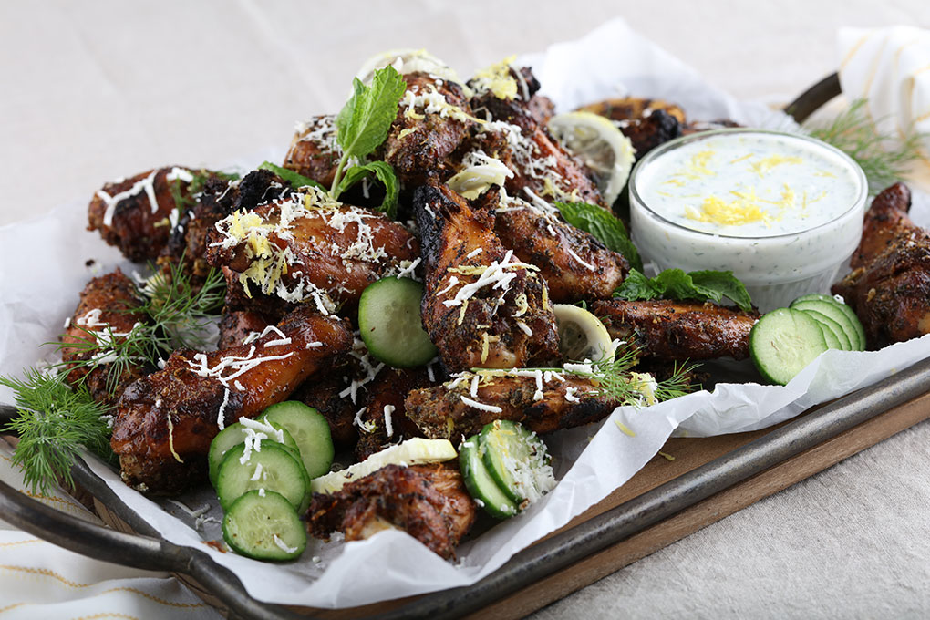 A robust spice mix, including rosemary, cinnamon and dill, lend a savory counterpoint to the tzatziki coated Smokin’ Greek Chicken Wings.