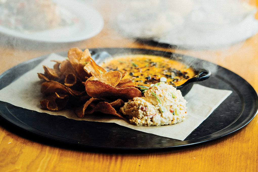 The Rustic, with four locations in Texas, includes a rich brisket, spinach and smoked cheddar fondue in its Smoked Dip Duo, a head-turning appetizer that also features pimento dip and smoked salt potato chips.