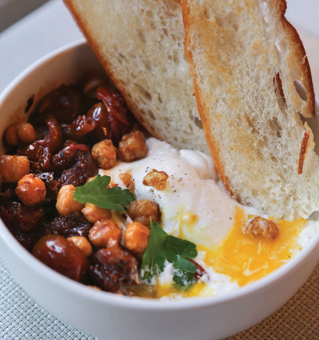 The Egg Shop in New York menus the Burrata and Egg Yolk, creating a novel twist on the classic poached egg by placing a yolk inside a round of burrata and pairing it with a tomato agrodolce, deep-fried chickpeas, fresh parsley and toast drizzled with truffle oil.