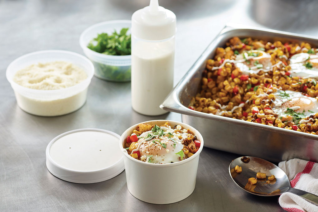 For this Mexican Street Corn & Egg Bake, Robert Danhi suggests batch cooking the eggs (poached or coddled) separately, then nestling them into the mixture of roasted corn, chiles and jicama. For service, simply spoon a portion into a to-go container.