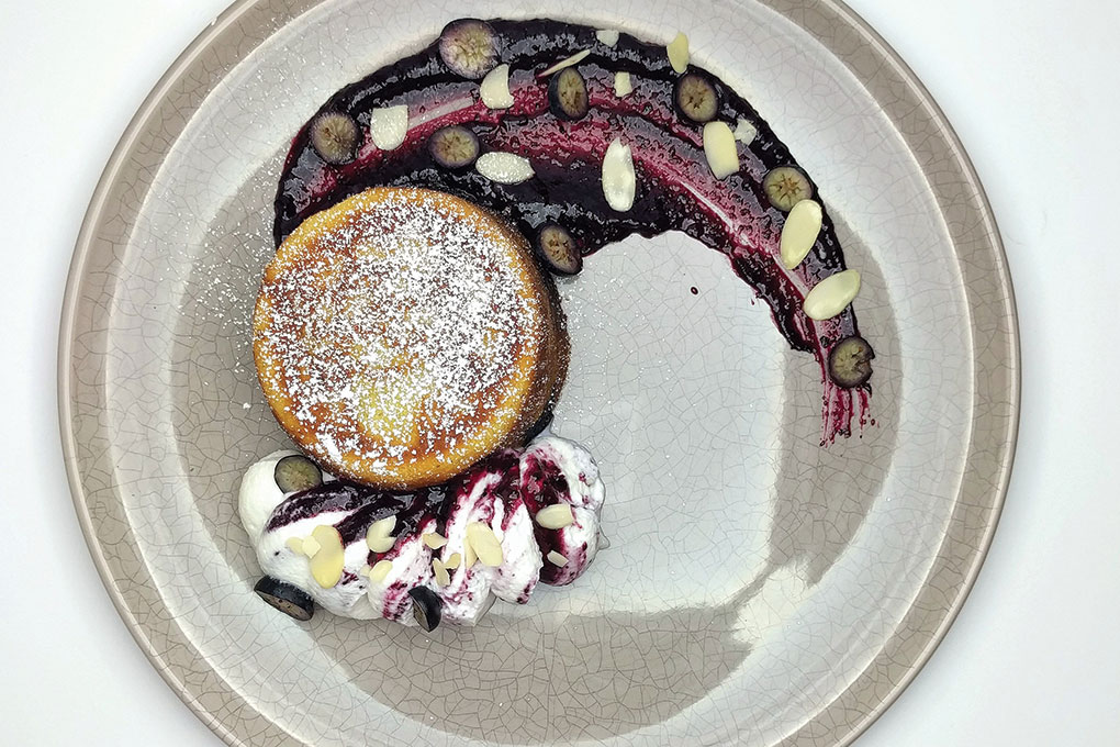 Chef Kevin Cecilio’s variation of the French dessert flaugnarde flips it into a brunch item, made less sweet and with blueberries providing a comforting bridge.