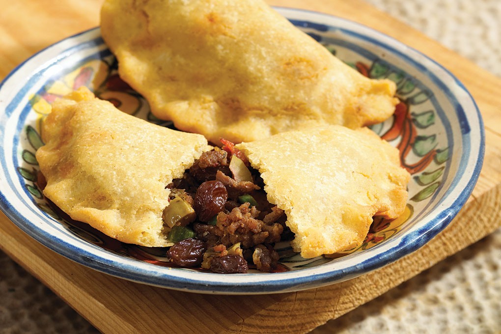 Picadillo, the versatile beef dish common throughout Latin America, highlights the fantastic flavor play between briny olives and plumped raisins, particularly when played against umami-rich beef and tomato.