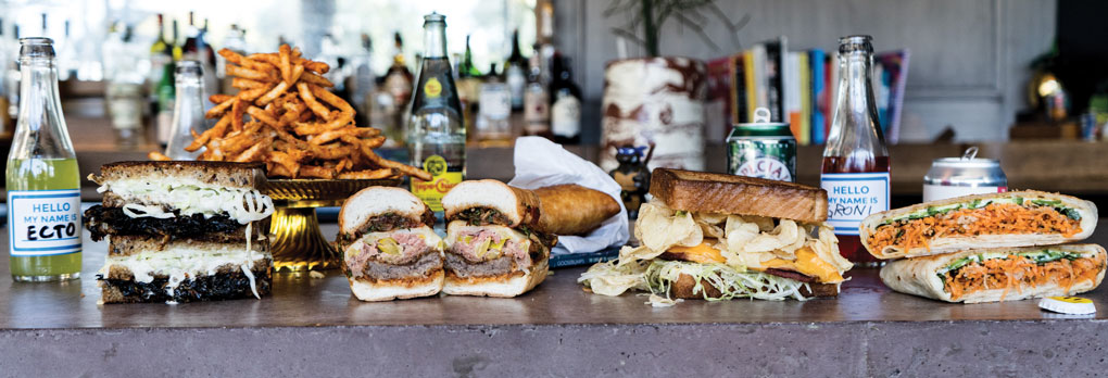 The newly opened Big Kids in Chicago menus culinary-inspired, fun, nostalgic, over-the-top sandwiches, including (left to right): the Collard Melt, Amy N Nettie, Fried Bologna and the Banh Mi Crunch Wrap.