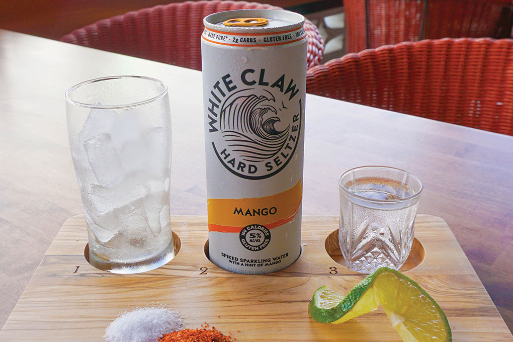Tampa’s Jotoro Kitchen + Tequila Bar takes a DIY route with its Cactus Claw featuring a can of White Claw alongside a shot of Patrón Tequila, twist of lime, salt and Tajín seasoning.