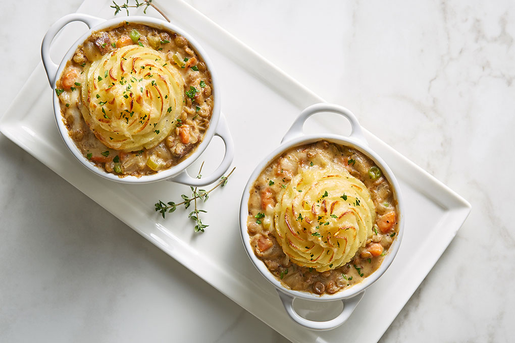 The ultimate comfort meal, Chef Jeff Mann’s shepherd’s pie centers around a hearty bourbon-braised vegetable stew and is topped with creamy Burbank Russet mashed potatoes.