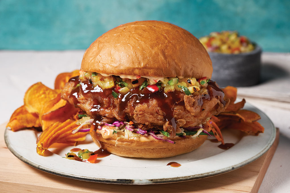 King’s Hawaiian Little Island Buns make a perfect carrier for a variety of inspirations, including this Honolulu Hot & Sweet Crispy Chicken sandwich with pineapple-habanero relish.