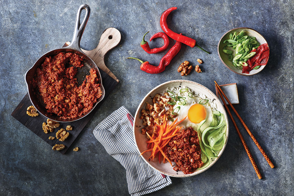 This Korean Bulgogi Bowl stars crumbled walnut “meat” mixed with riced cauliflower and sautéed with onion, garlic, dates, gochujang and soy sauce.