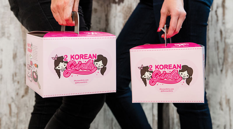 Distinct branding helps 2 Korean Girls keep its virtual concept top of mind, promoting its “pink boxes of joy” on social media.