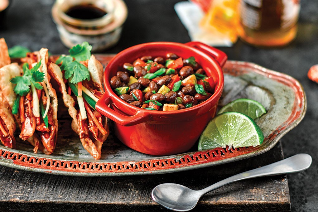 These Bahn Mi Tacos in crunchy wonton shells offer a modern spin on tacos, buddying up to a flavorful Black Bean Salsa that echos the flavors in the build with pickled daikon, carrot and jalapeño, cilantro, avocado and tomato.