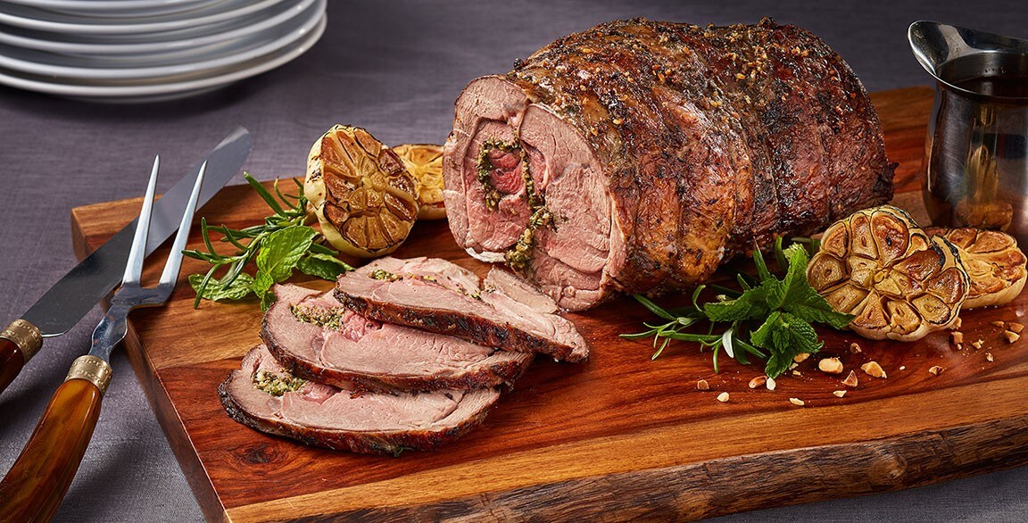 Boneless leg of lamb is marinated with fresh thyme, mint and rosemary, prepared sous vide and served with a hazelnut-infused demi-glace.