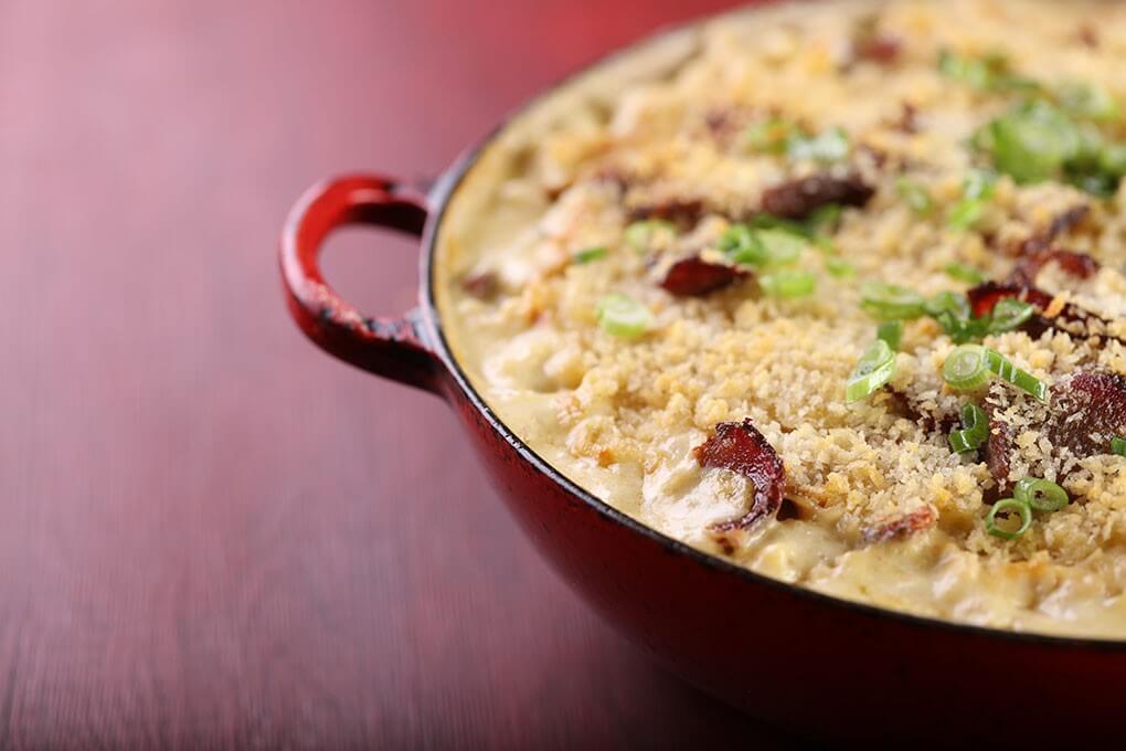 Comforting mac and cheese gets a culinary upgrade, served in a user-friendly bake format, in this Smoked Brisket and 5-Cheese Beer Mac, featuring a rich blend of five cheeses, lager, hot sauce and smoked beef brisket.
