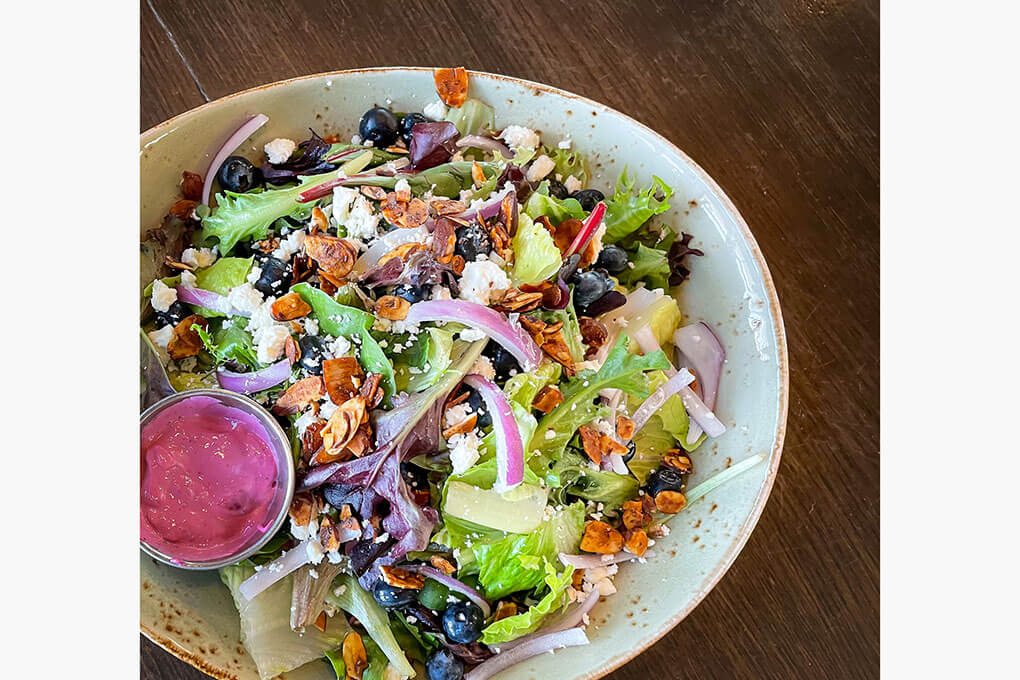 Romaine hearts, mixed greens, red onions, feta, honey-toasted almonds, blueberries and a lemon-blueberry vinaigrette