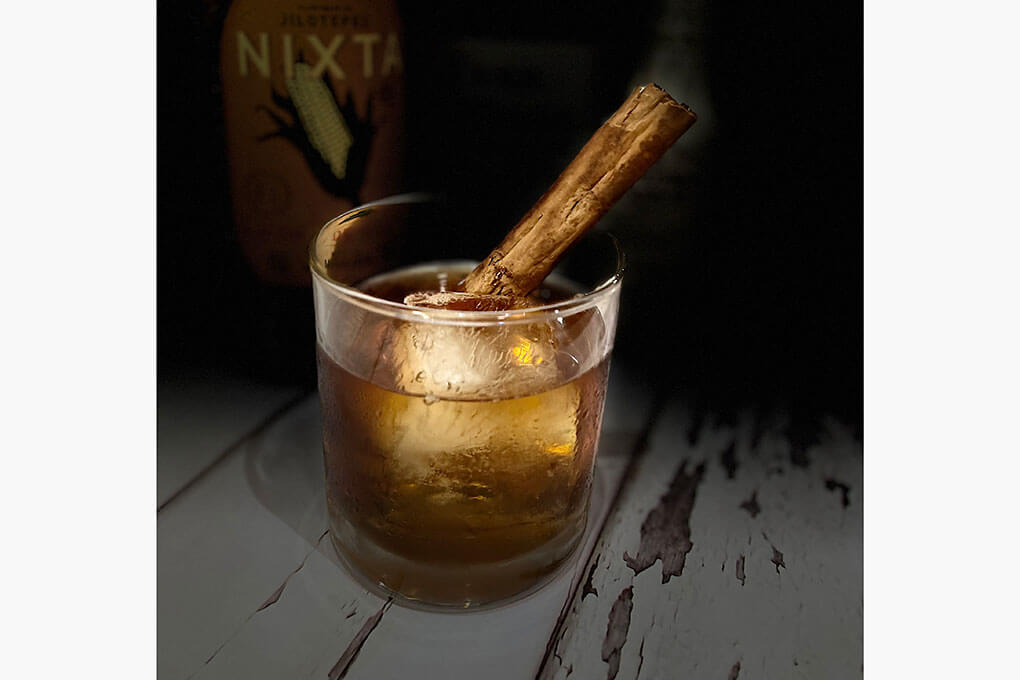 Evan Williams Bottled-in-Bond 100-proof bourbon, Nixta Licor de Elote, Aztec chocolate bitters and a roasted cinnamon stick