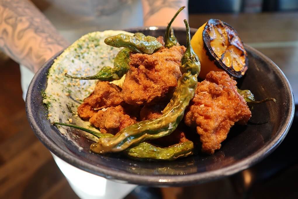 Chicken Karaage with shishito peppers, wasabi aïoli, furikake and charred lemon