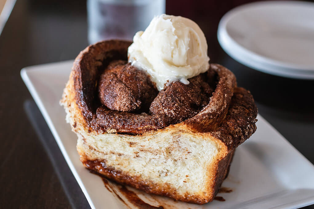 Cinnamon Roll with a dollop of cream cheese icing