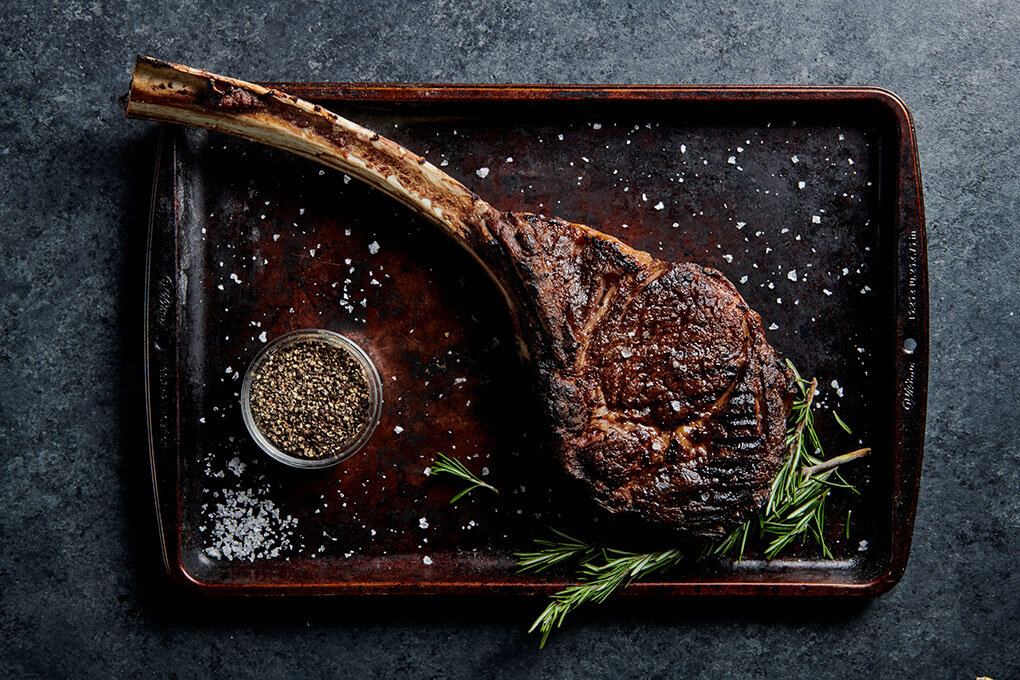 A 34-oz bone-in ribeye, dry-aged for intense flavor.