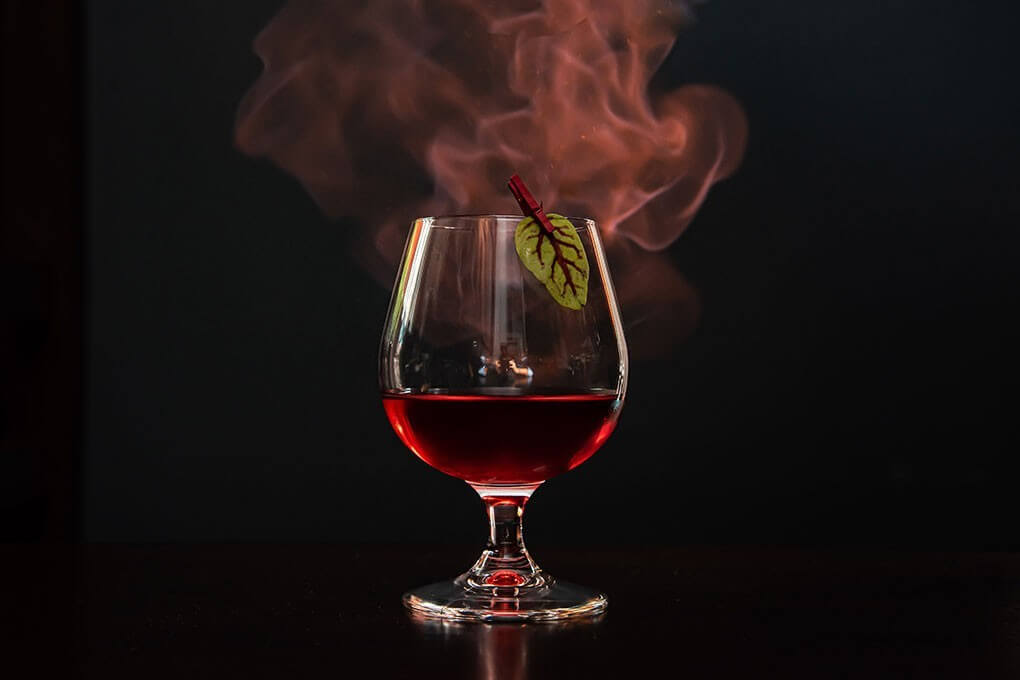 Stone-ground white whiskey, absinthe, lemon verbena-hibiscus simple, Peychaud’s bitters